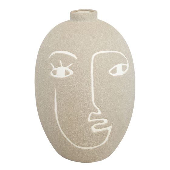 Clara vase ansikt sand.